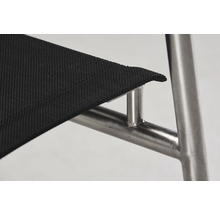 Detailansicht eines Stuhls mit Textilsitz und Metallgestell