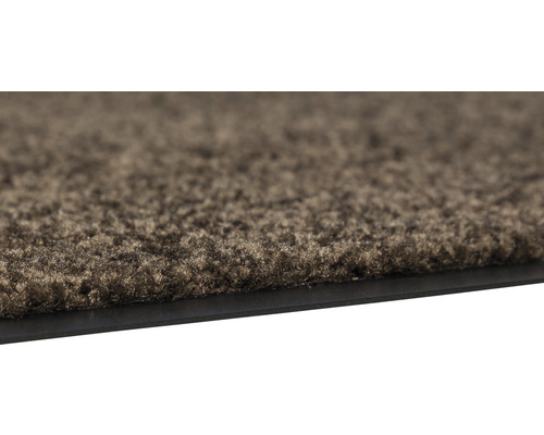 Detailansicht einer Fußmatte mit Textiloberfläche und Gummirand