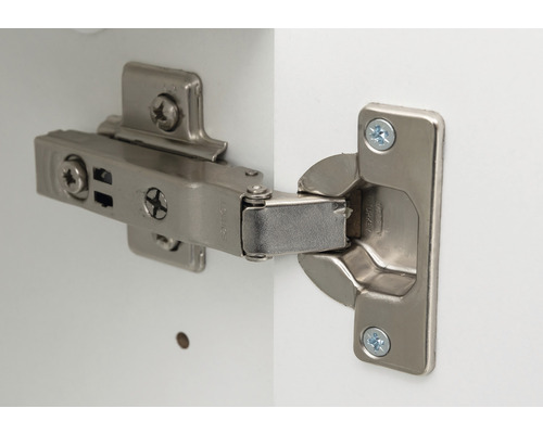 Möbelscharnier mit Schrauben zur Befestigung an einer weißen Oberfläche