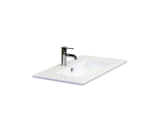 Waschtisch aus Sanitärkeramik mit Armatur