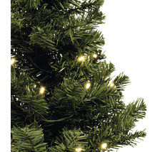 Detailaufnahme eines grünen, künstlichen Weihnachtsbaums mit Beleuchtung