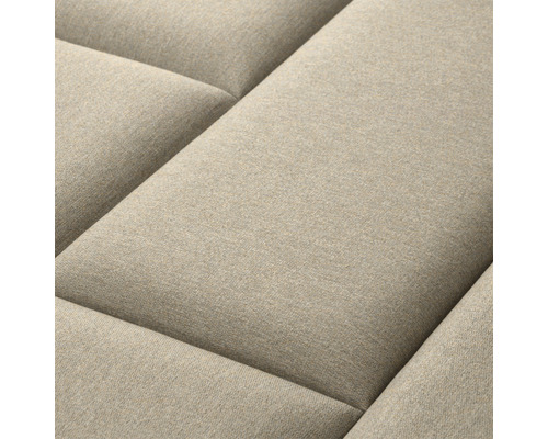 Nahaufnahme eines beigen Sofas mit gesteppter Oberfläche