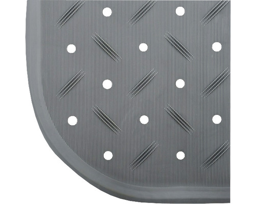 Detail einer Duschmatte mit Löchern und gerippter Oberfläche