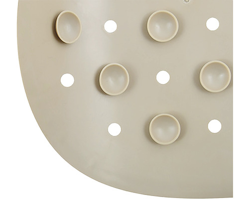 Detailansicht einer Duschmatte mit Saugnäpfen und Löchern