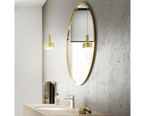 Modernes Badezimmer mit ovalem Spiegel, Waschtisch und Beleuchtung