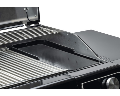 Detailansicht eines Grills mit Grillrost und Grillplatte
