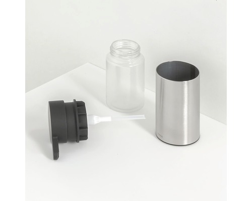 Demontierter Seifenspender aus Metall, Kunststoff und Glas