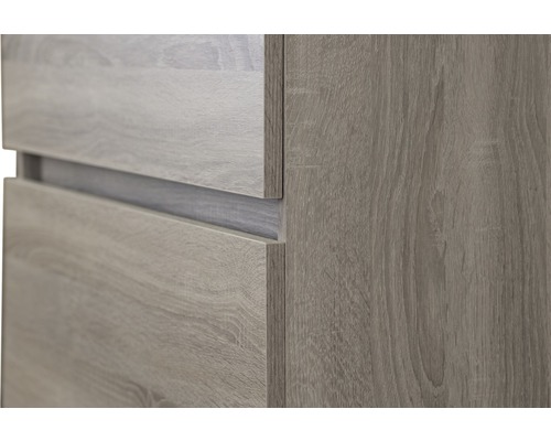 Detailansicht eines Möbels mit Holzstruktur und Schubladen