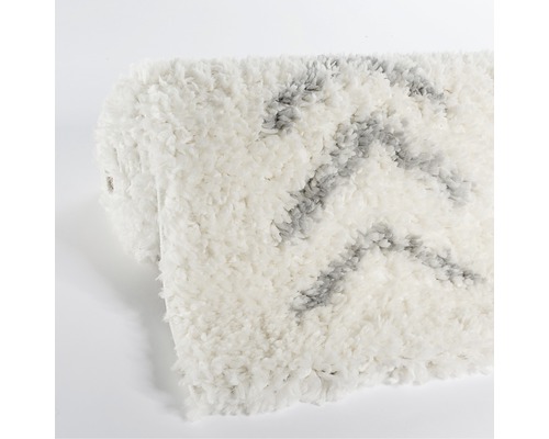 Weißer Teppich mit grauem Muster