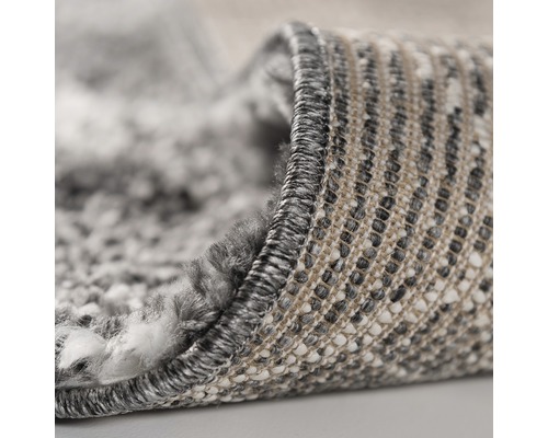 Detailansicht eines Teppichs mit Melange-Optik und gekettelten Rändern