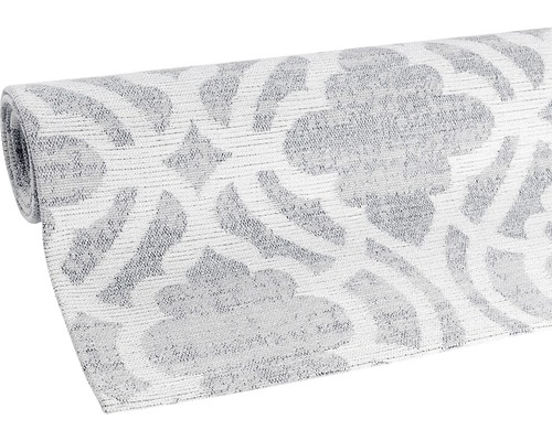Grau-weißer gemusterter Teppich aufgerollt