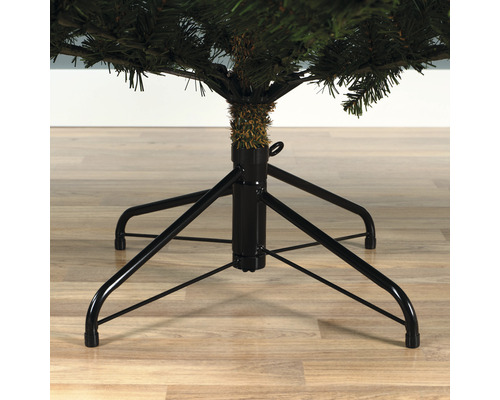 Christbaumständer aus Metall mit vier Füßen unter einem künstlichen Weihnachtsbaum