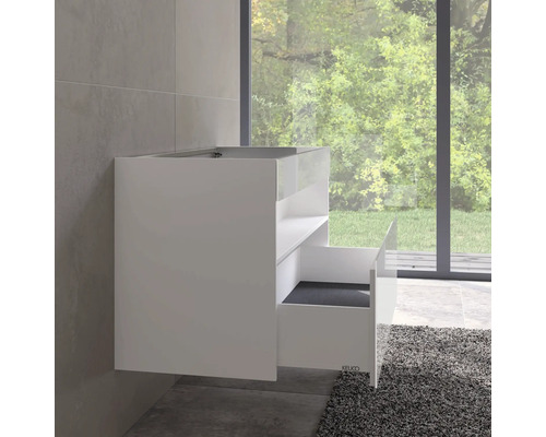 Weißer Waschbeckenunterschrank mit offener Schublade im Badezimmer.