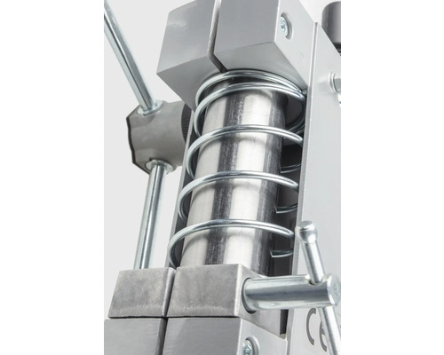 Detailansicht einer Metallpresse mit Feder