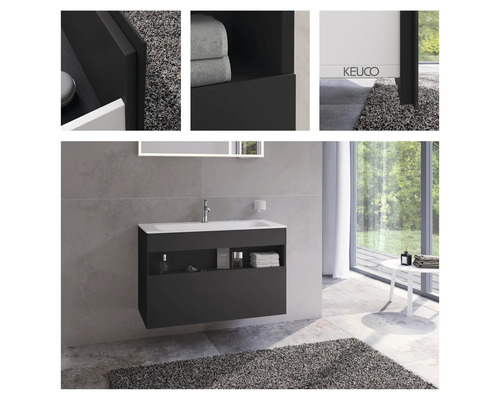 Modernes Badezimmer mit Waschbeckenunterschrank und Ablageflächen.