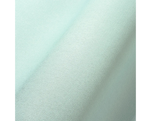 Nahaufnahme einer hellen Vliestapete mit leichter Struktur