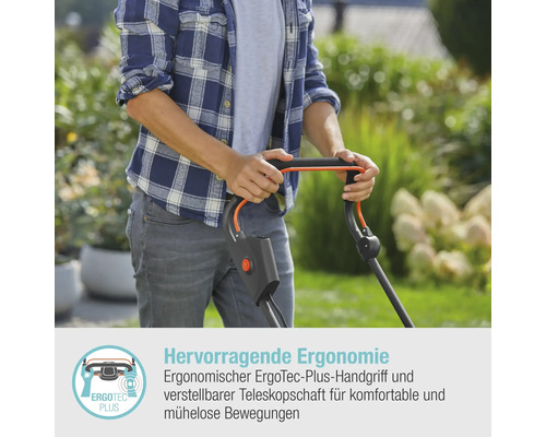 Eine Person bedient einen Rasenmäher im Garten.