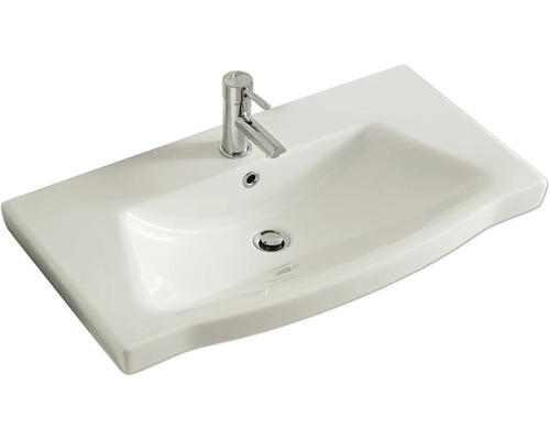 Waschbecken aus Keramik mit Armatur