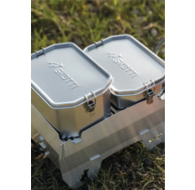 Zwei silberne SHOTTI Lunchboxen auf einem Grill