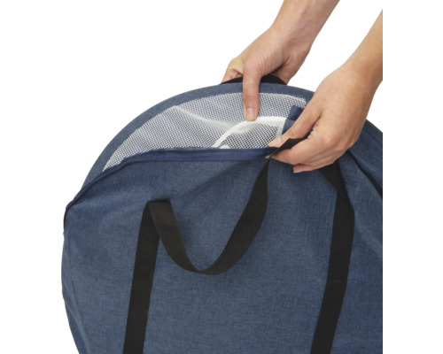 Transporttasche mit Netzgittereinsatz wird von Händen geöffnet