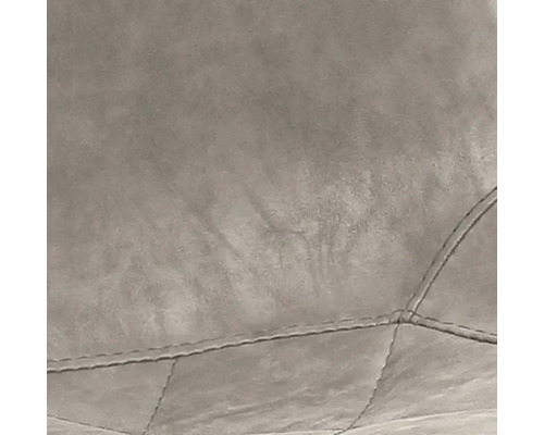 Detailaufnahme eines Möbelstücks mit gestepptem Bezug