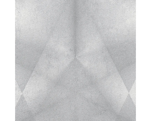 Nahaufnahme einer hellen Wand mit geometrischen Mustern.