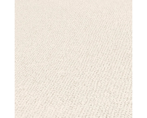 Nahaufnahme einer hellen Textiloberfläche mit feiner Struktur