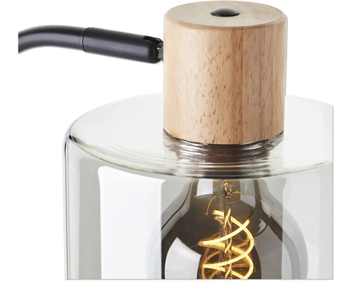 Detailaufnahme einer Tischleuchte mit Holzfuß und Glaskörper