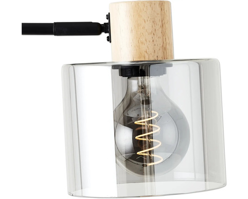 Detailaufnahme einer Lampe mit Holzfuß und Glasschirm