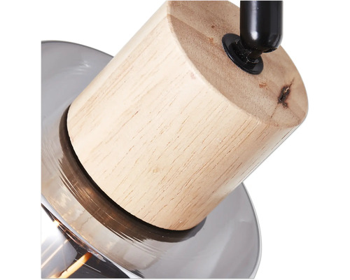 Detailaufnahme einer Leuchte mit Holz- und Glaselementen.