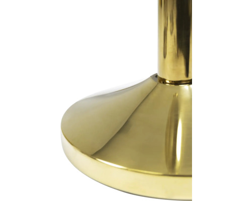 Detailaufnahme eines goldenen Tischbeins aus Metall