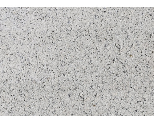 Nahaufnahme einer Betonoberfläche mit kleinen Steinen