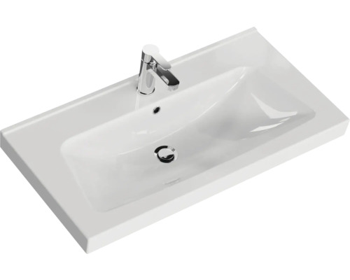 Weißes Keramik Waschbecken mit Armatur