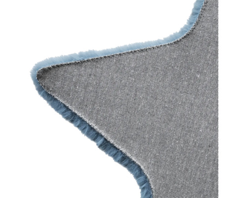 Detailansicht eines Teppichs in Sternform mit textiler Unterseite und Fransen