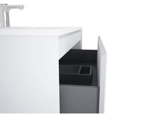 Detailansicht eines weißen Waschtischunterschranks mit offener Schublade