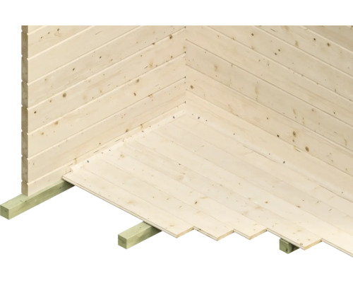 Innenecke eines Gartenhauses mit Holzwänden und Holzboden