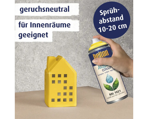 Helton Aqua Colours Lackspraydose wird auf gelbes Hausmodell gesprüht