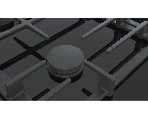 Detailaufnahme eines schwarzen Gasherds mit Brenner und Topfträger