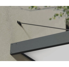 Detailansicht einer grauen Haustürüberdachung an einer Hauswand.