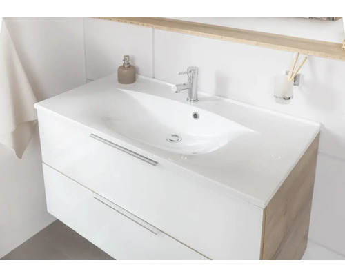 Waschtischunterschrank mit zwei Schubladen und Aufsatzwaschbecken im Badezimmer.