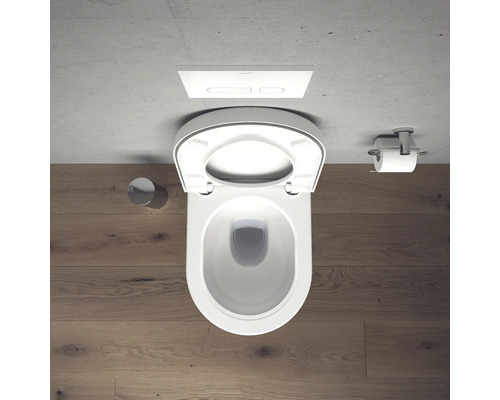 Aufnahme von oben einer Toilette mit offenem Toilettendeckel und Toilettenpapierhalter