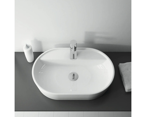 Aufsicht eines Waschbeckens mit Armatur, Seifenspender und Handtuch