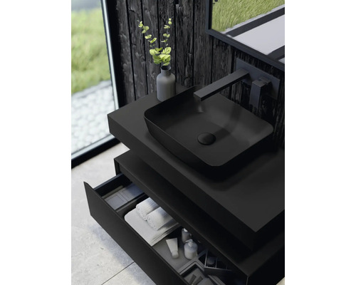 Modernes Badezimmer mit schwarzem Waschtisch, Aufsatzwaschbecken, Armatur und offenem Schubfach