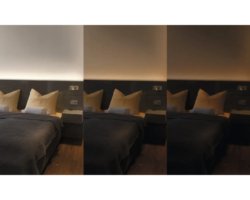 Schlafzimmer mit Bett, Nachttischen und Beleuchtung