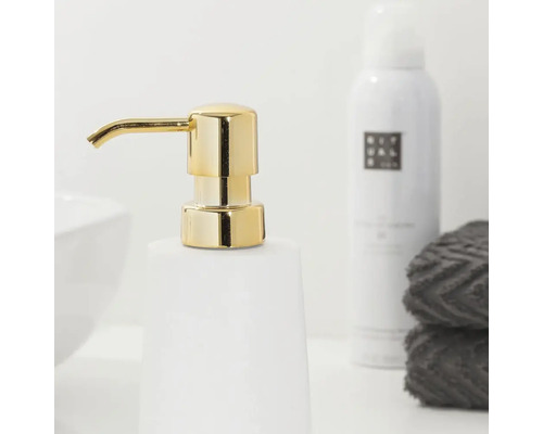 Seifenspender mit goldfarbener Pumpe