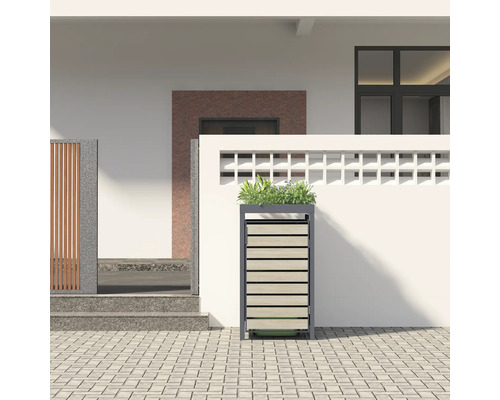 Mülltonnenbox mit Pflanzschale vor einem Haus