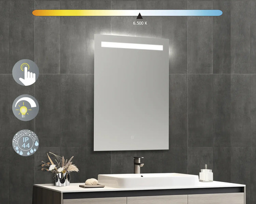 Beleuchteter Badezimmerspiegel mit Touchsensor und IP44 Schutzart vor grauer Wand