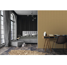 Schlafzimmer mit Bett, Schreibtisch und geriffelter Wandverkleidung