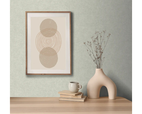 Dekoratives Stillleben mit gerahmtem Bild, Vase, Tasse und Büchern