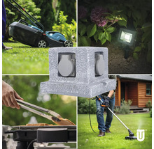 Mehrfachsteckdose für den Außenbereich im Einsatz mit Rasenmäher, Gartenbeleuchtung, Grill und Rasentrimmer.